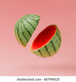 Watermelon sliced on pastel pink background. Minimal fruit concept.