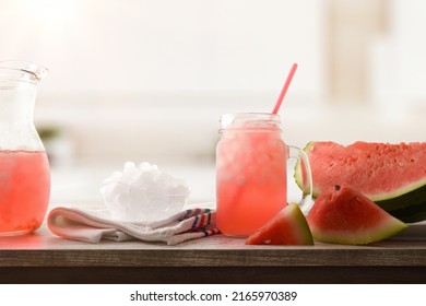 Watermelon Slush With Sliced Fruit And Crushed Ice In A Bowl On Wooden Table In A Kitchen. Front View. Horizontal Composition.