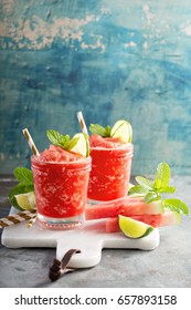 Watermelon slushie cocktail with lime, summer refreshing alcoholic drink
