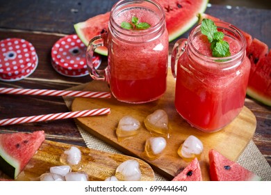 Watermelon smoothie juice on wooden table