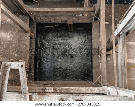 Waterproofing coating work using thick black membrane liquid in the elevator shaft