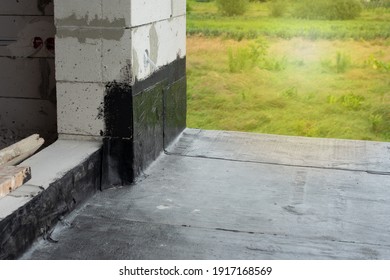 Waterproofing Flat Roof Terrace With Bitumen. Roof Waterproofing. Bitumen Insulating Layer. Covering Roofing Material.