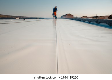 Waterproofing and insulation at construction site, waterproofing membrane preventing water penetration. Exterior vapor barrier for roof. 
