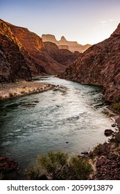 Waters of the Colorado River Glow in the Sunrise Light at the bottom of the Grand Canyon
