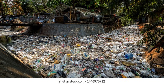 A Waterway In Asia Clogged With Plastic Pollution And Garbage So Thick You Can No Longer See The Water Underneath.