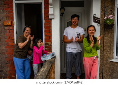 WATFORD, HERTFORDSHIRE, UK - MAY 21 2020: Residents On Chester Road, Watford, Clap Their Hands And Make A Noise For Carers And Key Workers. 