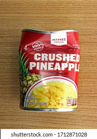 Waubedonia, WI – April 23, 2020: Crushed Pineapple Can, red and yellow, which is actually crushed. illustrative editorial.