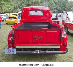 WAUPACA, WI - AUGUST 25: Back view of 1950 Ford F1 red Pickup truck at the 10th Annual Waupaca Rod & Classic Car Club Car Show on August 25, 2012 in Waupaca, Wisconsin.
