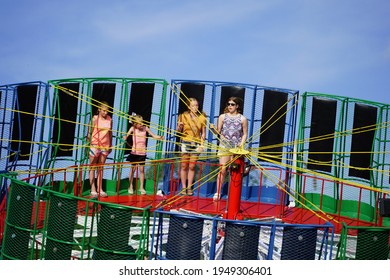 Waupun, Wisconsin USA - June 25th, 2019: Family And Young Adults Ride On Zero Gravity Carnival Ride At Celebrating Waupun Fair.  