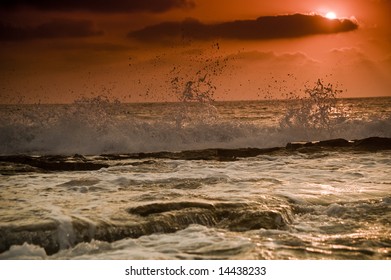 wave at a beach sunset