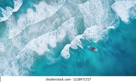 Wave and boat on the beach as a background. Beautiful natural background at the summer time from air - Shutterstock ID 1118971727