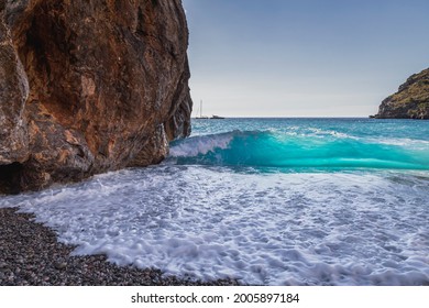 Wave braking on the shore of sa calobra in the valley of the torrent de pareis