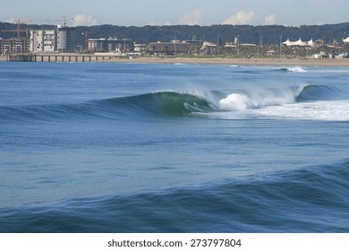 A Wave Breaks Along The Golden Mile In Durban, South Africa.