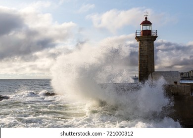 Wave Crashing In The Lighthouse At The Atlantic Ocean Coast