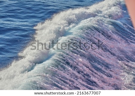 Wave of large oceangoing vessel proceeding by ocean
