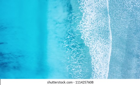 Wave on the beach as a background. Beautiful natural background at the summer time