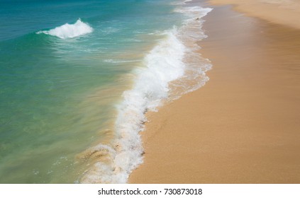 Wave on the beach sand