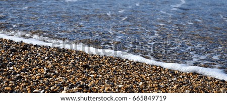 Similar – Lots of colorful stones on the beach