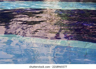 Wave Pool Water With Blue Floor Mat And Reflection Of Stripes