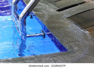 Wave Pool Water With Blue Floor Mat And Reflection Of Stripes