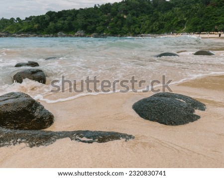 Wave and rock at Freedom beach in Phuket