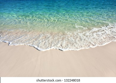 Wave of the sea on the sand beach - Shutterstock ID 132248018