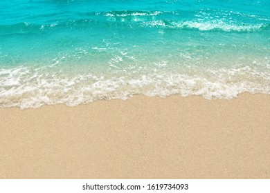 Wave of the sea on the sand beach for space text or background. - Shutterstock ID 1619734093