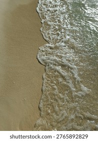 The wave is toucing the sand