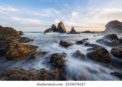 Wave water flowing into the rocky shore of Camel Rock, Bermagui, Australia. - Powered by Shutterstock