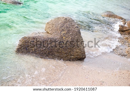 Wave Water with Shape Stone Love Heart Nature,Ocean Tropical Beach Sand at Coast,for Couple Tourism Vacation Travel Summer Holidays or Valentine Day and Broken heart Concept.