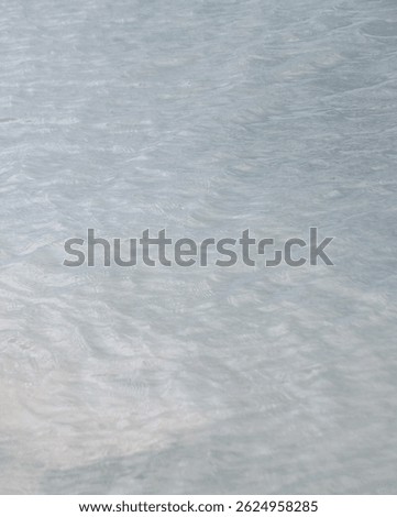 Wavelets on sea surface. Blue water.