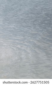 Wavelets on water surface. Blue sea.