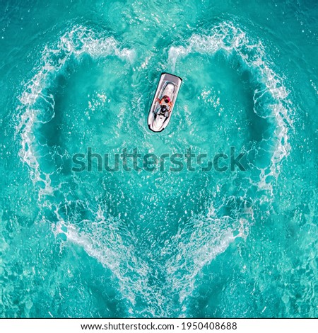 Waverunner aquabike splash love heart top symbol water jet drive or jet pump. Aerial view water motorcycle Maldives watersports events