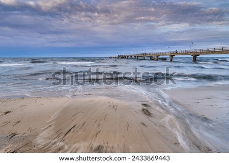 Waves at the Balticsea with a bridge                