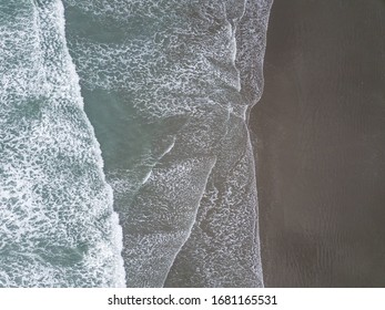 Waves And Beach Aerial Shot From Bird Eye View. Made In Christchurch, New Zealand.