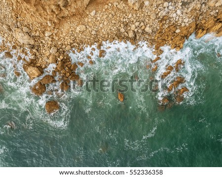 Similar – Aerial Drone View Of Dramatic Ocean Waves Crushing On Rocky Landscape