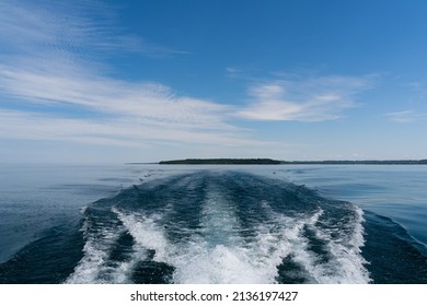 Waves Behind Boat On A Lake