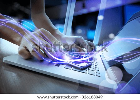 Waves of blue light and businessman using on smart phone as concept