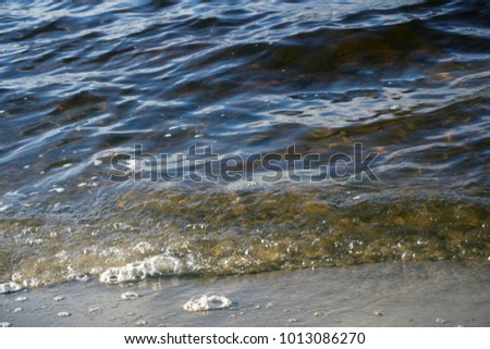 Waves break on the granite stone near the shore of the Gulf of Finland near the village of Repino, Leningrad region. Saint-Petersburg, Russia, water landscape Granite in the water