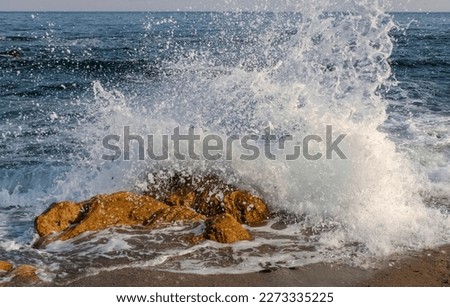 Similar – waves and splashes of sea surf and stones on the seashore in Egypt Dahab South Sinai