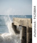 waves breaking at a pier