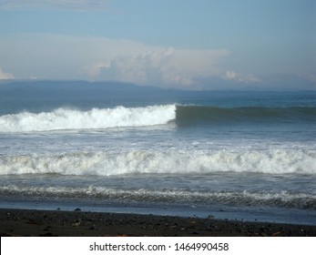 Waves breaks into surf along beach in Pavones, Costa Rica.
