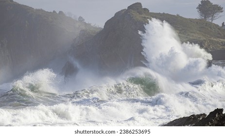 waves crash against the cliff - Powered by Shutterstock