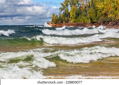 Waves crash on the rocky coast of Lake Superior at Michigan's Pictured Rocks National Lakeshore in autumn. Shot in Michigan's Upper Peninsula not far from Munising. - Shutterstock ID 228803077