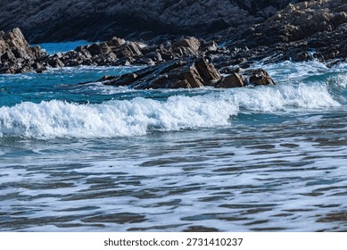Waves crashed against the black hexagonal volcanic rock columns.