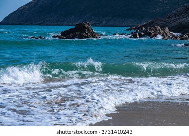 Waves crashed against the black hexagonal volcanic rock columns.