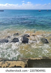 Waves Crashing Against The Rocks Near Shore