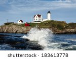 Waves crashing at Cape Neddick (Nubble) lighthouse in York, Maine. The beacon sits a few hundred feet from the mainland on a small rocky island, known as a "nubble".