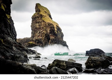 waves crashing into the rocks in talisker bay