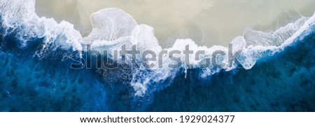 The waves crashing on the beach